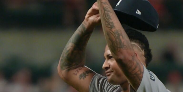 Luis Gil tips his cap