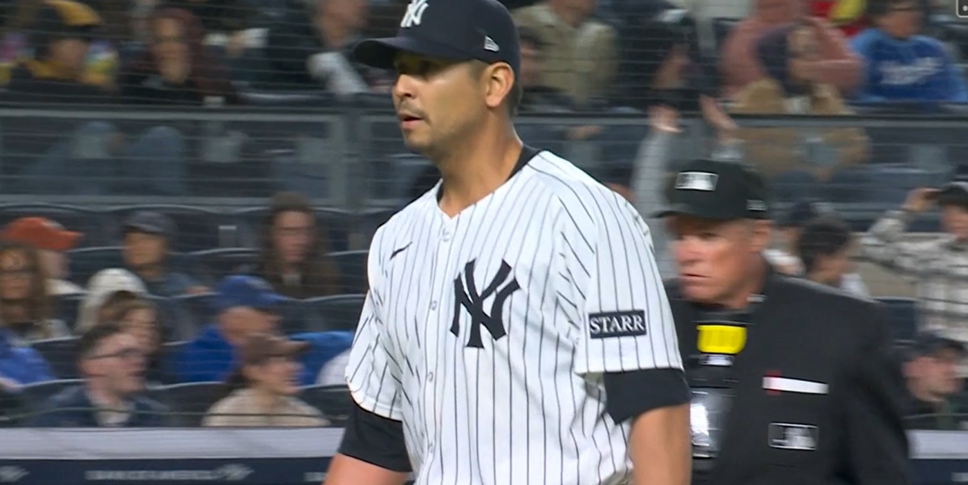 Carlos Carrasco walks off the mound with a tie game