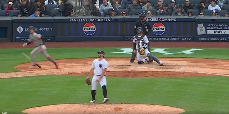 Carlos Rodon watching a three-run home run head for the stands