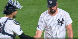 Rodon and Escarra shake hands