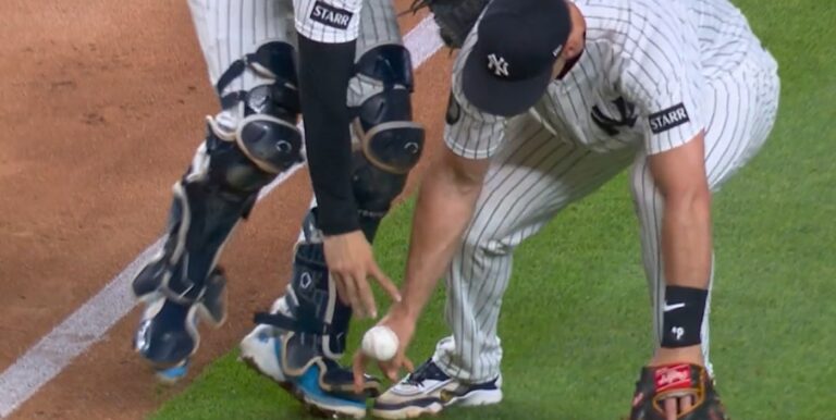 Schlittler and Wells go for the same ball