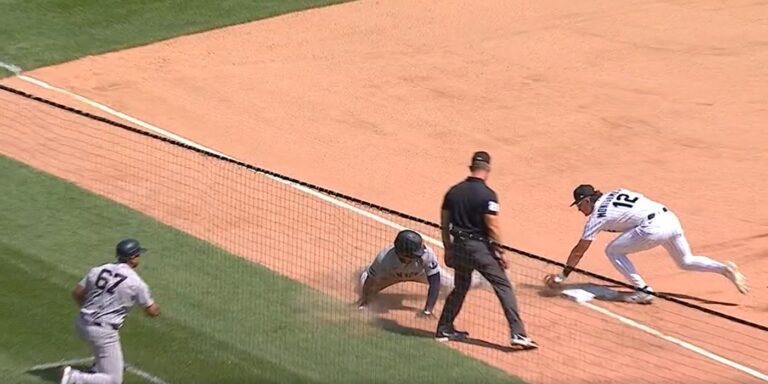Dominguez overslides third base