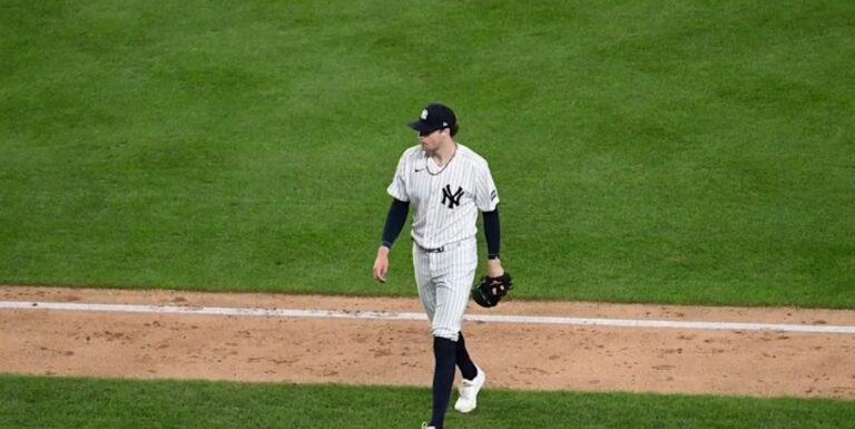 Cam Schlittler walks off of the field